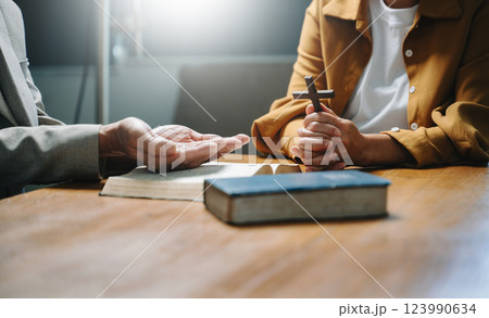 Christians are congregants join hands to pray and seek the blessings Christians are congregants join hands to pray and seek the blessings 123990634