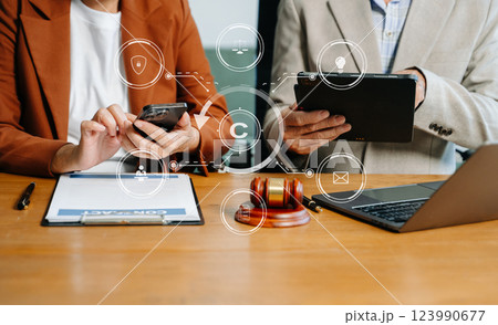 Copyright or patent concept, Business team analyzing data and using smart phone and tablet with virtual screen 123990677
