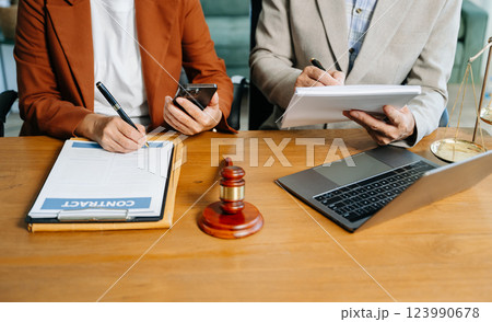 business people and lawyers discussing contract papers sitting at the table. Concepts 123990678