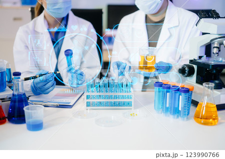 Healthcare professional holding Coronavirus COVID-19 vaccine in laboratory study and analyze scientific sample Healthcare professional holding Coronavirus COVID-19 vaccine in laboratory study and analyze scientific sample 123990766