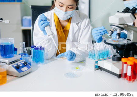 Scientists, beakers, and microscopes in cutting-edge research. Perfect for science and technology projects. Scientists, beakers, and microscopes in cutting-edge research. Perfect for science and technology projects. 123990855