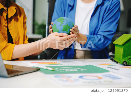 business team people planning and discussing on recycle reduce reuse policy symbol in office meeting room. business team people planning and discussing on recycle reduce reuse policy symbol in office meeting room. 123991879