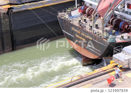 Ship crossing Panama Canal at Miraflores Locks - Panama City, Panama 123997839