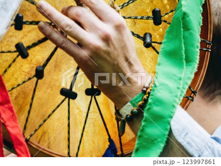 Shamanic festival, playing the shamanic drum, shamanic ritual of invoking good spirits 123997861