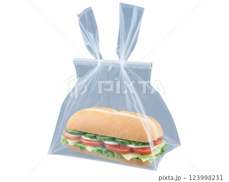 Transparent plastic sandwich bag with a simple fold-over top, commonly used for single-serve snacks or sandwiches, providing visibility and ease 123998231