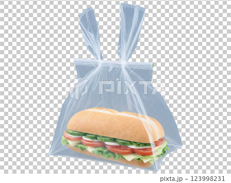 Transparent plastic sandwich bag with a simple fold-over top, commonly used for single-serve snacks or sandwiches, providing visibility and ease 123998231