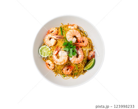 Crispy Pancit Malabon noodles with shrimp and seafood, vibrant yellow, orange, and green tones, isolated 123998233