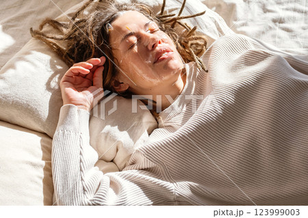 Woman Is Applying Beauty Mask On Her Face. 123999003