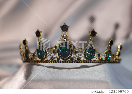 Royal crown with green emeralds. Royal crown with green emeralds. 123999769