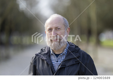 Portrait of smiling senior man enjoying retirement in park Portrait of smiling senior man enjoying retirement in park 124001689