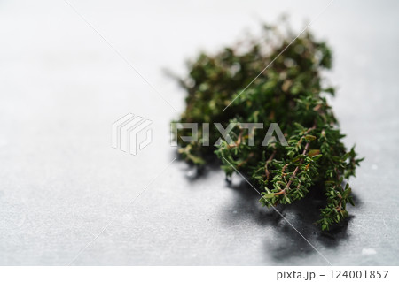 Fresh thyme on concrete countertop closeup Fresh thyme on concrete countertop closeup 124001857