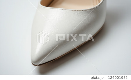 Elegant white leather pointed toe shoe close-up 124001983