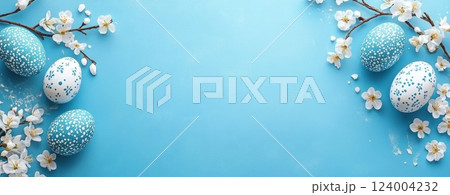 lue easter eggs and white cherry blossoms on bright blue background. Happy Easter concept. lue easter eggs and white cherry blossoms on bright blue background. Happy Easter concept. 124004232