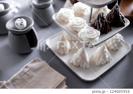 Elegant white and dark chocolate desserts on a tiered tray Elegant white and dark chocolate desserts on a tiered tray 124005958