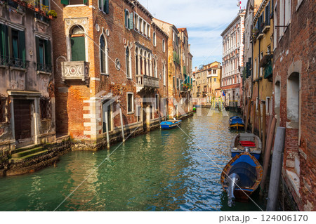 Traditional narrow romantic canal with old houses in Venice, Italy 124006170