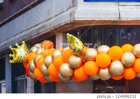 Building decorated with orange balloons for King Day in Netherlands Building decorated with orange balloons for King Day in Netherlands 124006232
