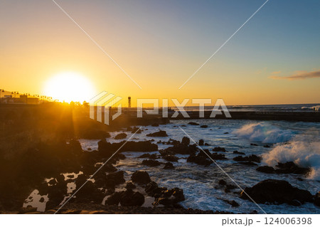 Sunset over Atlantic ocean in Puerto de la Cruz, Tenerife, Canary Islands, Spain 124006398