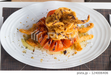 Crispy delicious fried squids served in a local restaurant in coastal village on Tenerife, Canary Islands, Spain 124006406