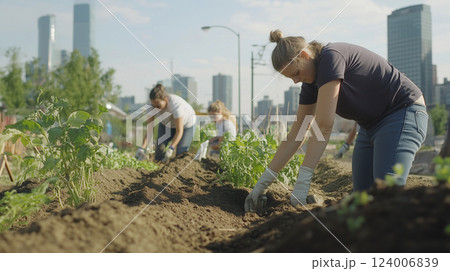 Community garden volunteers collaborating, planting organic vegetables and nurturing local sustainable agriculture initiatives Community garden volunteers collaborating, planting organic vegetables and nurturing local sustainable agriculture initiatives 124006839