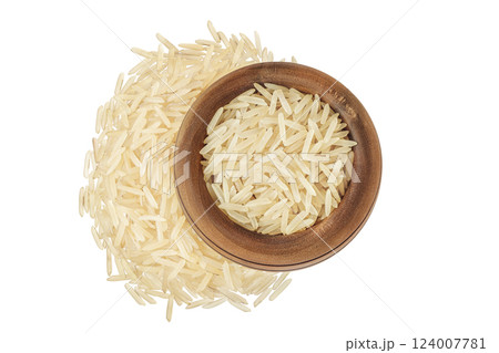 rice basmati in a wooden bowl isolated on white background. Top view. Flat lay 124007781