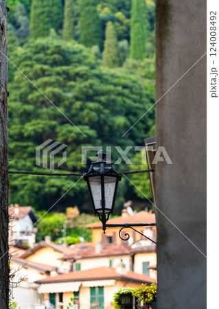Vintage Street Lamp with Scenic Village View near Varenna, Italy Vintage Street Lamp with Scenic Village View near Varenna, Italy 124008492