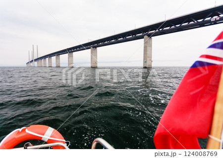Yacht and oresund bridge between denmark sweden 124008769