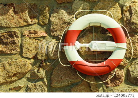 Rescue ring on sailing rock wall Rescue ring on sailing rock wall 124008773