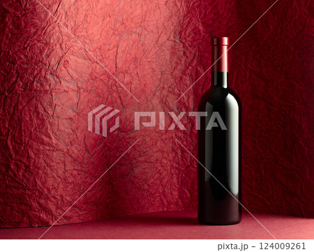 Bottle of red wine on a red background. Bottle of red wine on a red background. 124009261