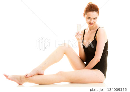 Woman showing electric razor depilator 124009356