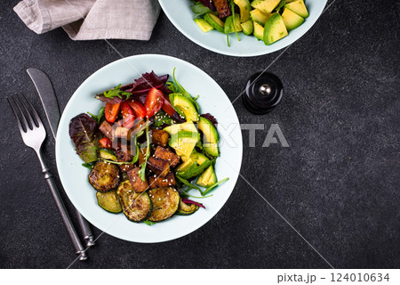 Healthy vegan keto salad with tofu and avocado 124010634