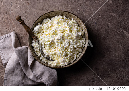 Cottage cheese on light background Cottage cheese on light background 124010693