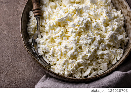 Cottage cheese on light background 124010708