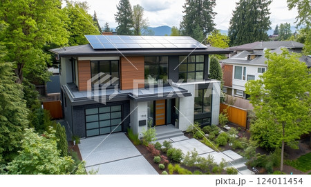 Modern eco-friendly home with solar panels and beautiful garden in a suburban area 124011454