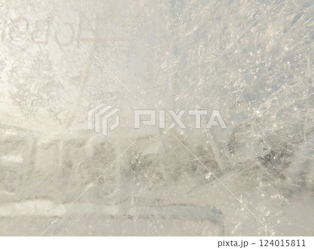 Ice texture background. Textured cold frosty surface of ice block with frozen air bubbles. Ice texture background. Textured cold frosty surface of ice block with frozen air bubbles. 124015811