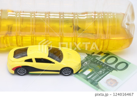 A bottle of vegetable oil and a typewriter lie on a banknote. Biodiesel, biofuel, vegetable oil A bottle of vegetable oil and a typewriter lie on a banknote. Biodiesel, biofuel, vegetable oil 124016467