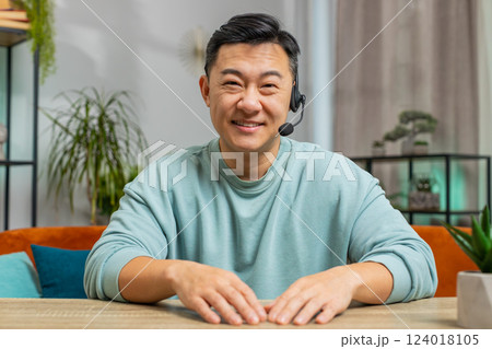 Asian man freelance worker call center, support service operator helpline having talk with client 124018105
