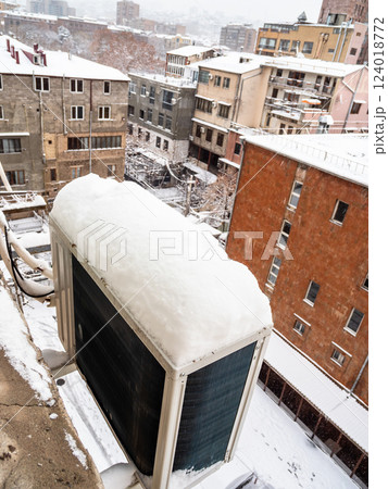 above view of snow covered air conditioner in yard 124018772