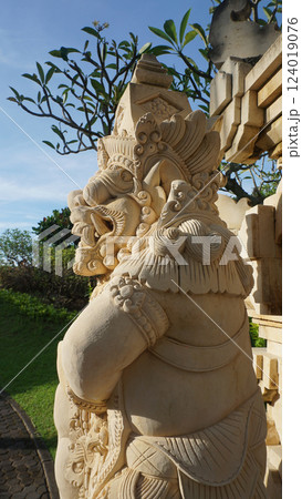 A stone statue that symbolizes the guard of the gate of a house or palace A stone statue that symbolizes the guard of the gate of a house or palace 124019076