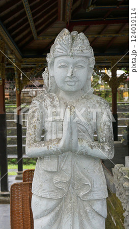 A stone statue that symbolizes the guard of the gate of a house or palace A stone statue that symbolizes the guard of the gate of a house or palace 124019114