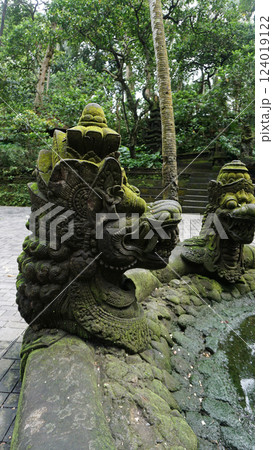 Statue at Ubud Monkey Forest - a sanctuary which is home to three Hindu temples Padangtegal, Ubud, Bali, Indonesia Statue at Ubud Monkey Forest - a sanctuary which is home to three Hindu temples Padangtegal, Ubud, Bali, Indonesia 124019122