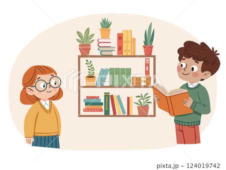 boy holding an open book and reading it to a girl boy holding an open book and reading it to a girl 124019742