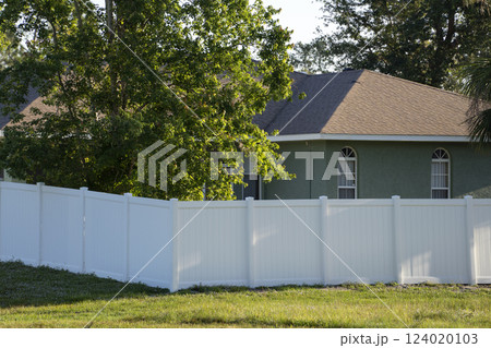 White plastic fence for back yard protection and privacy 124020103