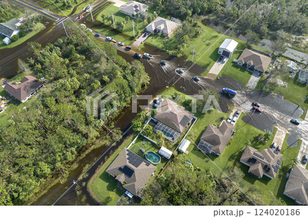 Surrounded by hurricane rainfall flood waters homes in Florida residential area. Aftermath of natural disaster 124020186