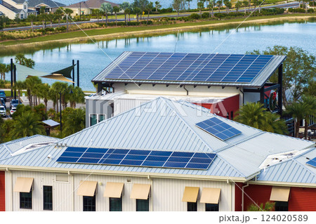 Solar rooftops on commercial center in Florida. Photovoltaic panels for producing of clean ecological electrical energy in city urban area. Concept of autonomous building 124020589