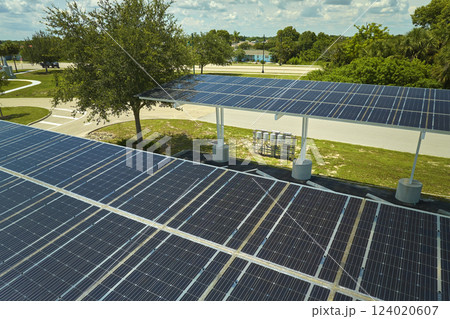 Solar panels installed over parking lot for parked cars for effective generation of clean energy 124020607