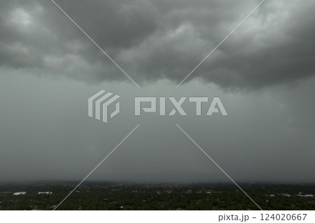 Rainstorm shower over Florida rural town in humid summer season. Rain water pouring down from stormy clouds Rainstorm shower over Florida rural town in humid summer season. Rain water pouring down from stormy clouds 124020667