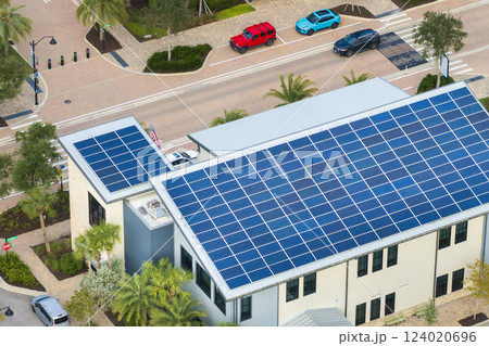 Photovoltaic panels on solar rooftop of Florida commercial building for producing clean ecological electrical energy. Renewable electricity with zero emission concept Photovoltaic panels on solar rooftop of Florida commercial building for producing clean ecological electrical energy. Renewable electricity with zero emission concept 124020696