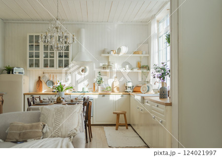 Scandinavian classic minimalistic kitchen with white and wooden details flowers. Modern white kitchen clean contemporary style interior design. Empty bright white interior minimal of kitchen Scandinavian classic minimalistic kitchen with white and wooden details flowers. Modern white kitchen clean contemporary style interior design. Empty bright white interior minimal of kitchen 124021997