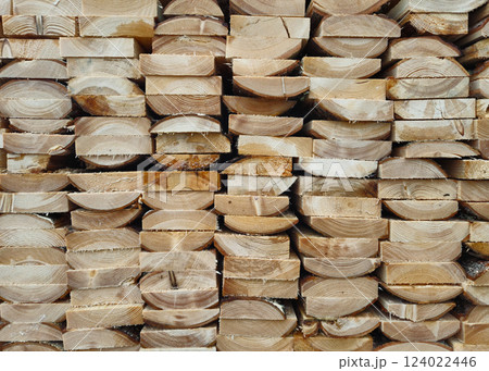 Stacked Wooden Logs Arranged in Neat Horizontal Alignment Close-Up 124022446