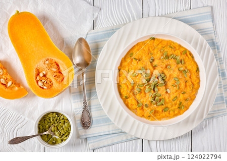 butternut squash puree with pumpkin seeds in bowl butternut squash puree with pumpkin seeds in bowl 124022794